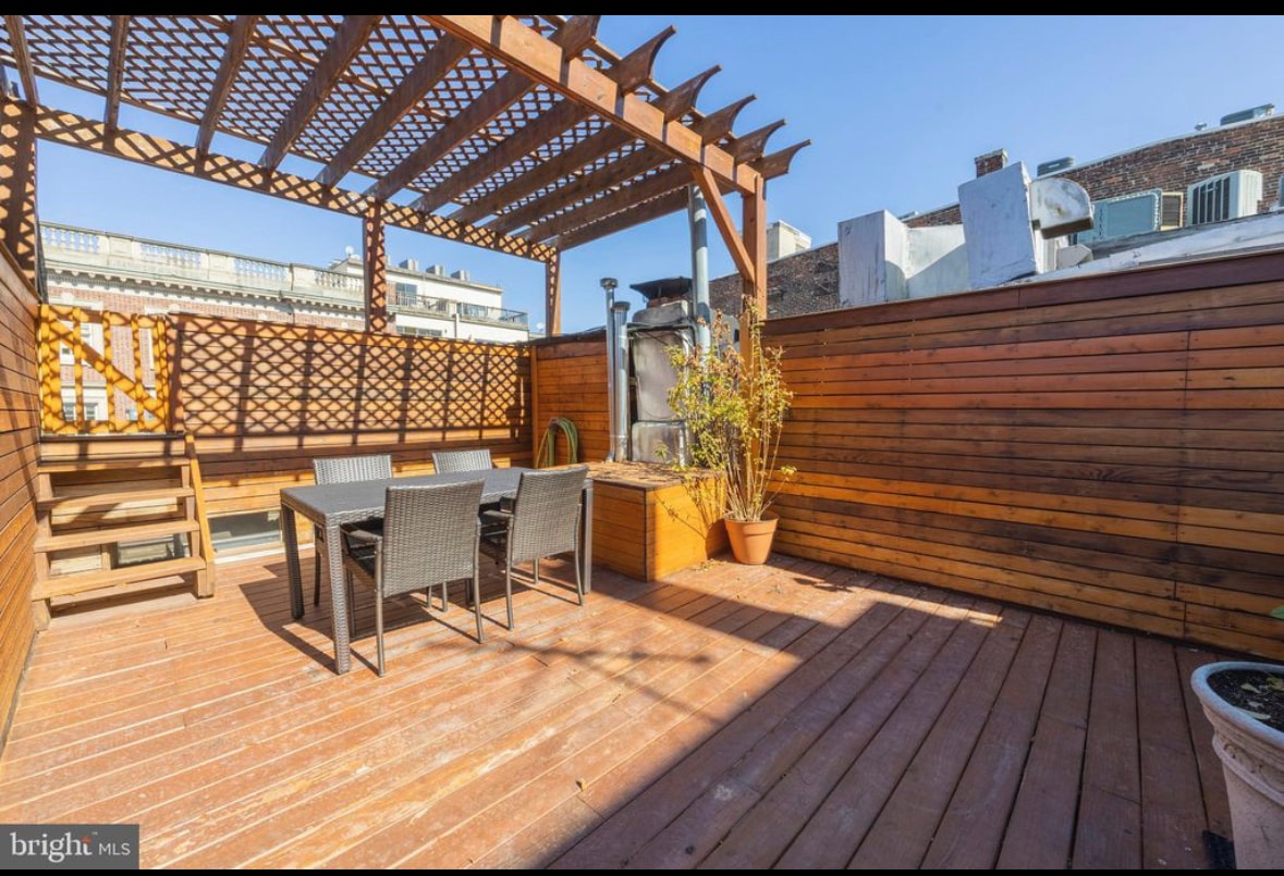 2nd floor roof deck with pergola and city views